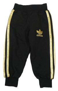 Černo-zlaté tepláky s pruhy Adidas