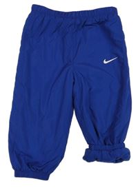 Safírové šusťákové zateplené cuff kalhoty s logem Nike